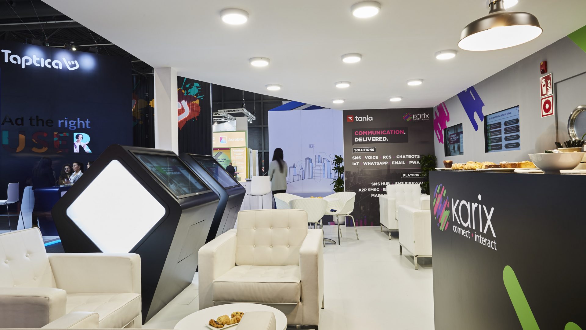 Karix stand at MWC 2019 - lounge area with bar and custom made demo stations