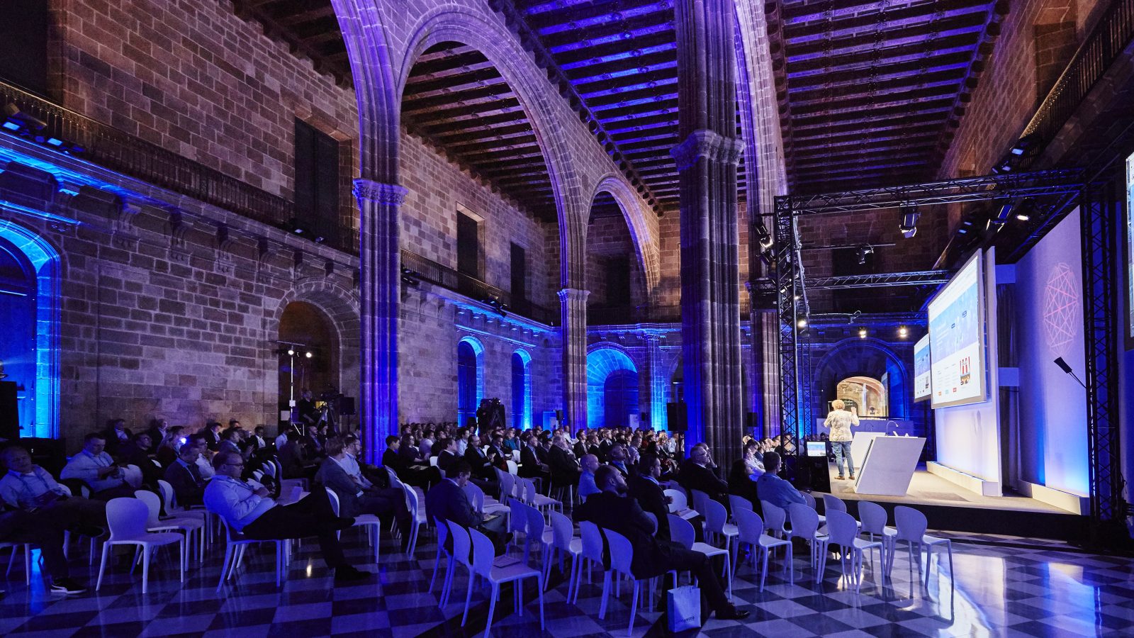 Conference venue from Barcelona with columns and full stage setup